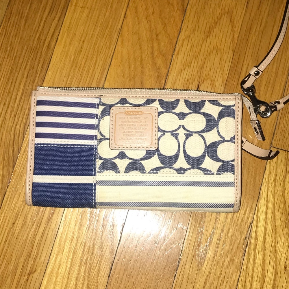 Blue and off white canvas Coach zippered wallet with wrist strap